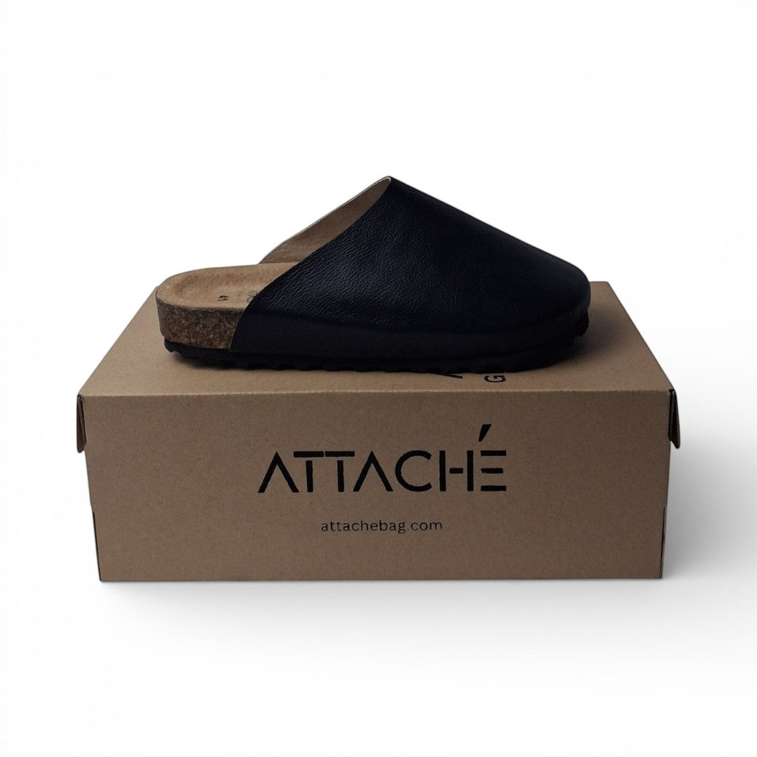 Attache Bags black grain leather mule clog with cork sole and rubber outsole. Comfortable slip-on design.